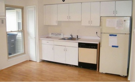 Kitchen before remodel - dated cabinets, laminate counters and older appliances