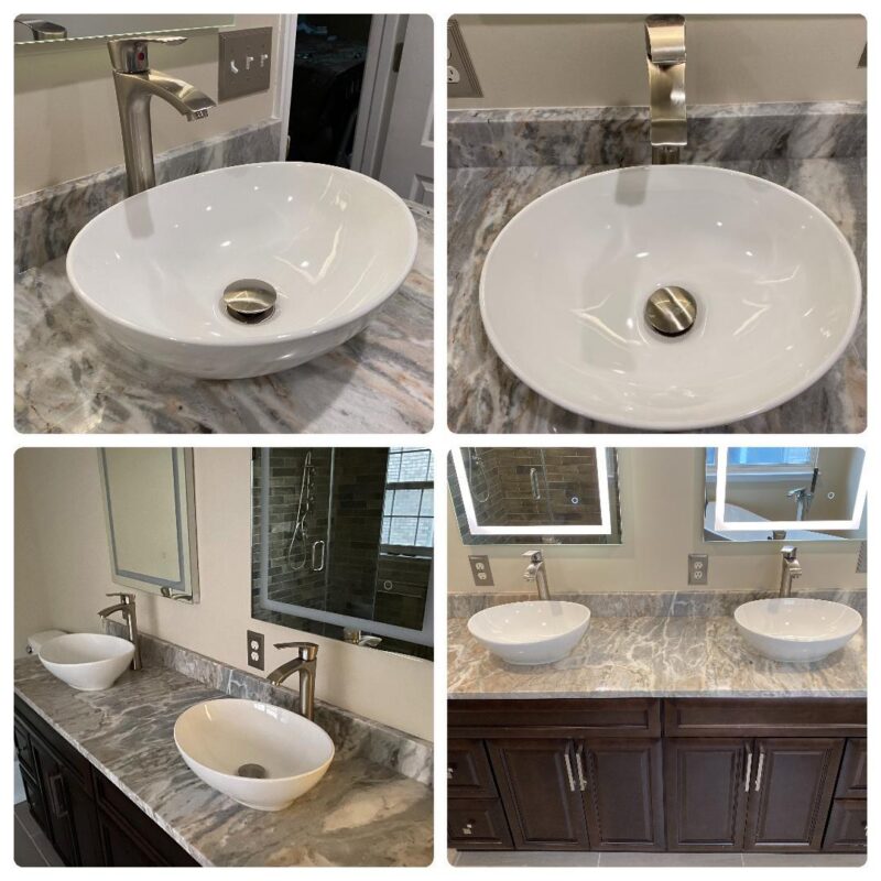 Vessel sinks on a marble-look countertop with espresso vanity and lighted mirrors