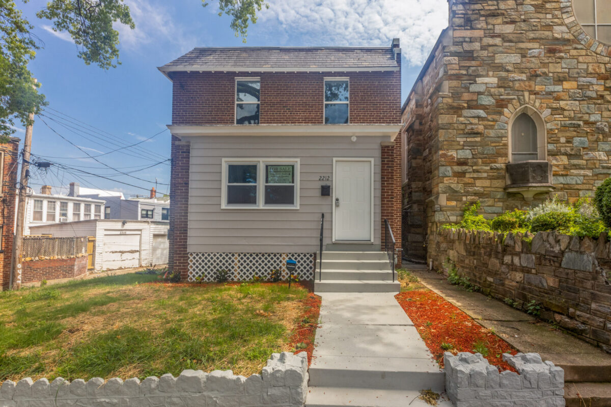 Renovated brick and siding row house with new front steps