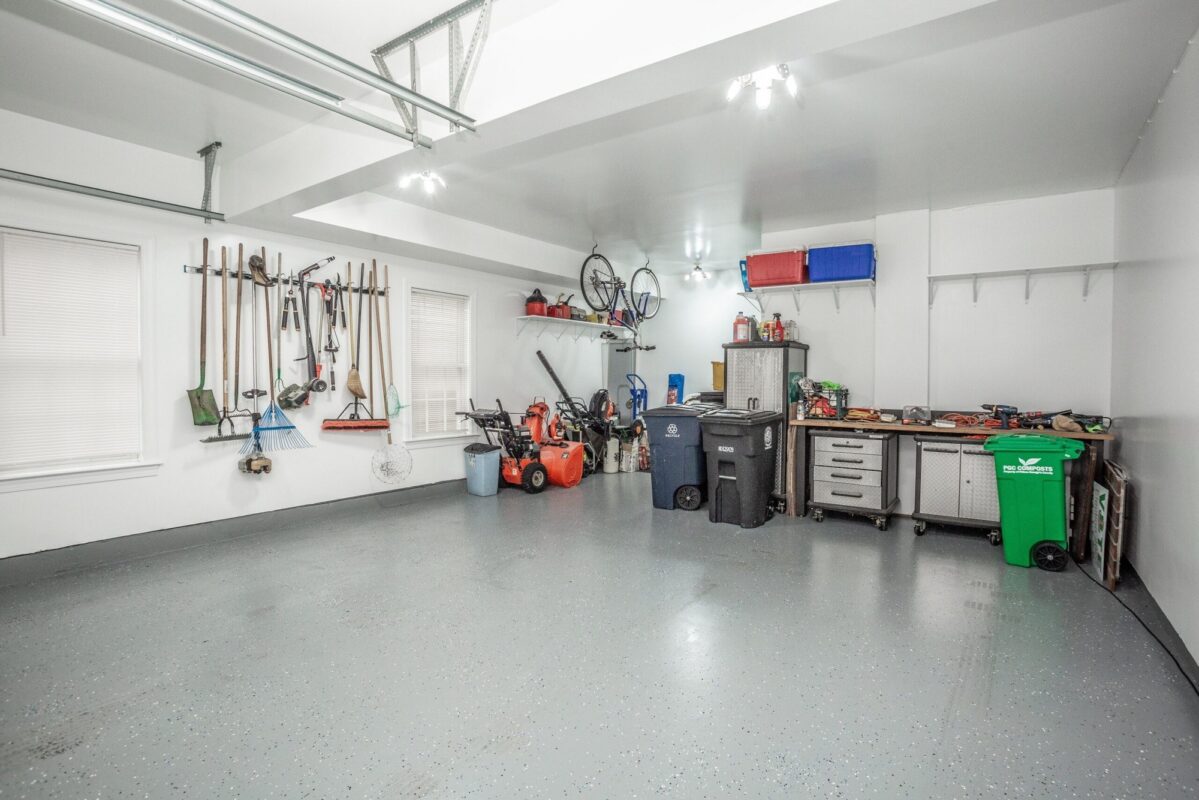 Finished garage with epoxy floor, wall storage and workbench