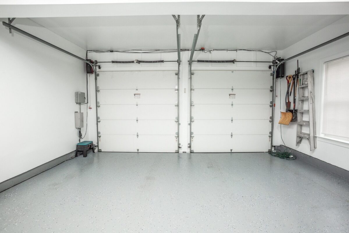 Garage with epoxy floor and two overhead doors