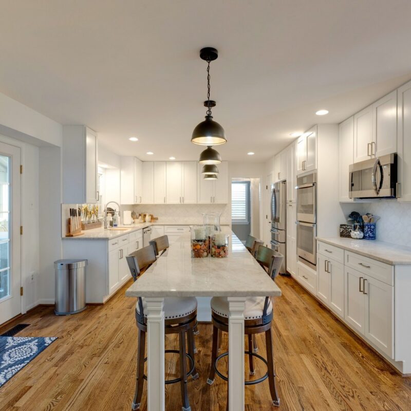Kitchen remodeling - white shaker cabinets and island seating